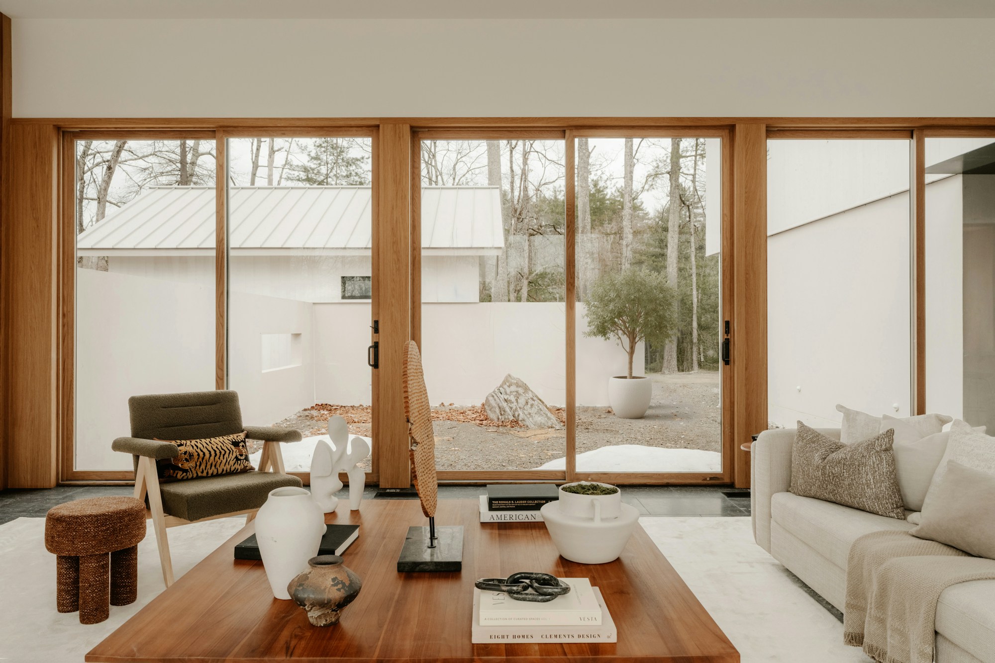 Airy living space with floor-to-ceiling garden-facing windows
